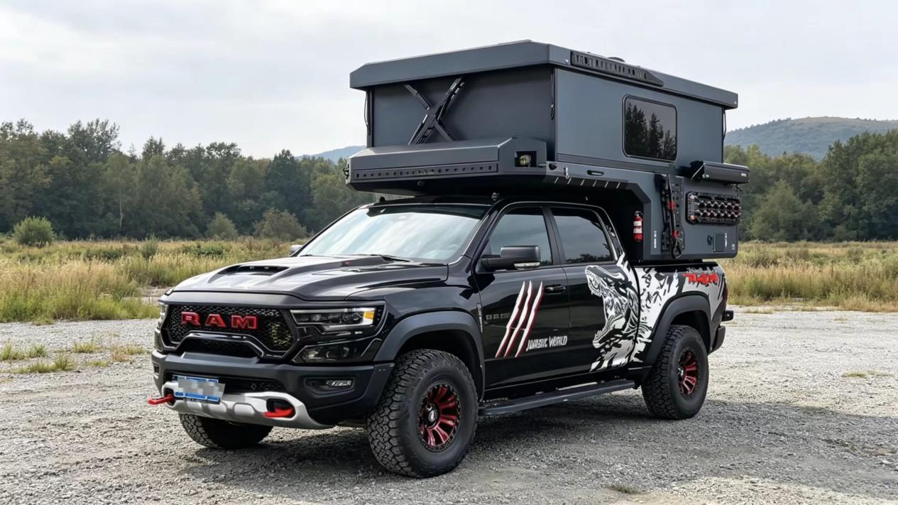 Black hardtop camper on a pickup truck